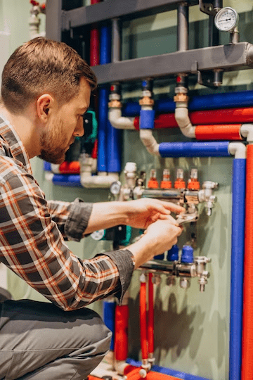 Young engineer adjusting autonomous heating